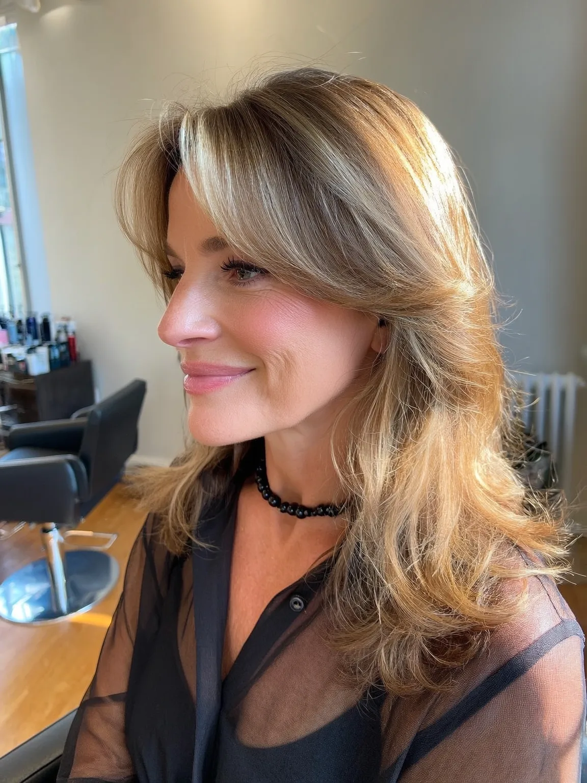 Medium-Length Wavy Face-Framing Layers with Curtain Bangs